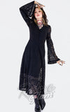 Woman wearing a black lace dress with long sleeves on a white background Woman wearing a black lace dress with long sleeves on a white background