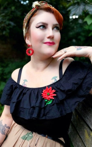 Lipstick & Chrome Enamel Poinsetta Brooch model
Lipstick & Chrome Enamel Poinsetta Brooch model