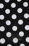 Black fabric with white polka dots