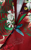 Close-up of a floral-patterned garment with a zipper, featuring the 'Retro Glam' brand.