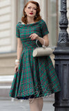Dolly and Dotty Darlene Dress in Green Tartan model