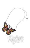 Butterfly necklace with colorful wings on a white background, featuring the 'Retro Glam' brand.