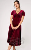 Woman's dress in burgundy velvet holiday