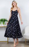 Black midi dress with a celestial print of sun, moon, and stars.