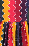 Collectif Amber-Lea Rainbow Wave Swing Dress fabric