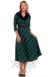 Voodoo Vixen green plaid Lola flare Dress with 3/4 sleeves, removable fur collar, and belted waist front on model